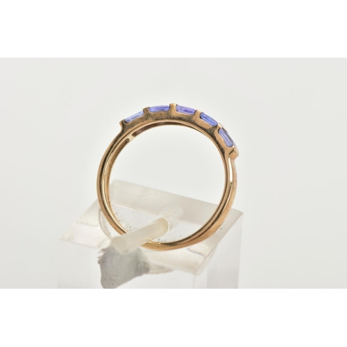 149 - A 9CT GOLD TANZANITE HALF HOOP RING, designed with a row of five bar set, square cut tanzanite's, le... 