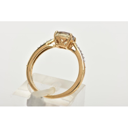 151 - A 9CT GOLD GEM SET RING, designed with a central square cut pale green stone, flanked with diamond d... 