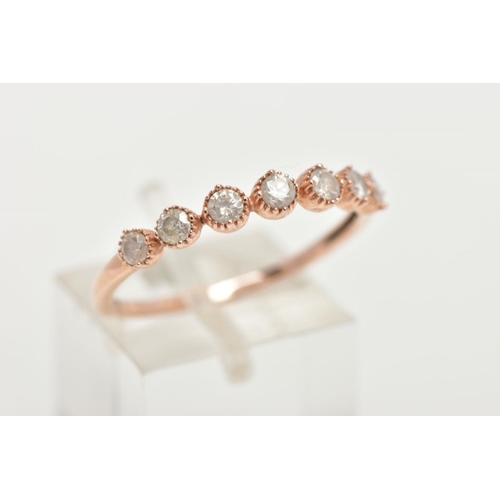 155 - A 9CT ROSE GOLD DIAMOND HALF ETERNITY RING, designed with a row seven round brilliant cut diamonds, ... 