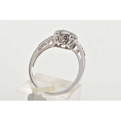 165 - A 14CT WHITE GOLD DIAMOND RING, of a circular design, set with round brilliant cut diamonds and roun... 