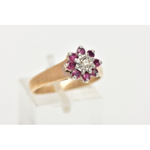 168 - A 9CT GOLD RUBY AND DIAMOND CLUSTER RING, flower shape cluster set with a central round brilliant cu... 