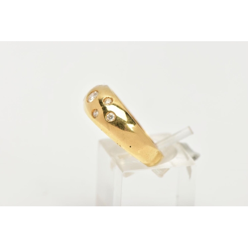 170 - A YELLOW METAL RING, wide band set with seven circular cut colourless cubic zirconia stones each in ... 