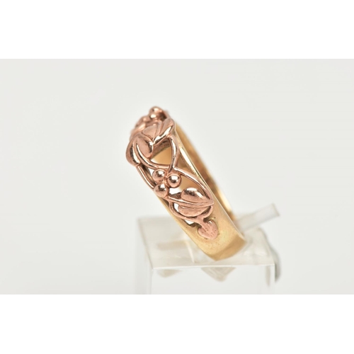 174 - A 9CT GOLD CLOGAU RING, a plain polished yellow gold band with an open work entwined foliage design ... 