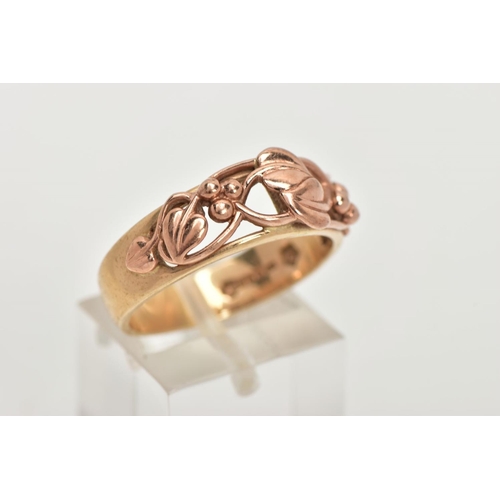 174 - A 9CT GOLD CLOGAU RING, a plain polished yellow gold band with an open work entwined foliage design ... 