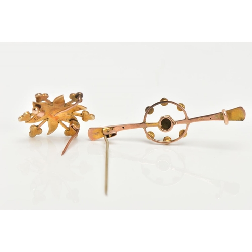 183 - TWO EARLY 20TH CENTRURY GOLD BROOCHES, the first brooch of a yellow gold floral design, set with thi... 