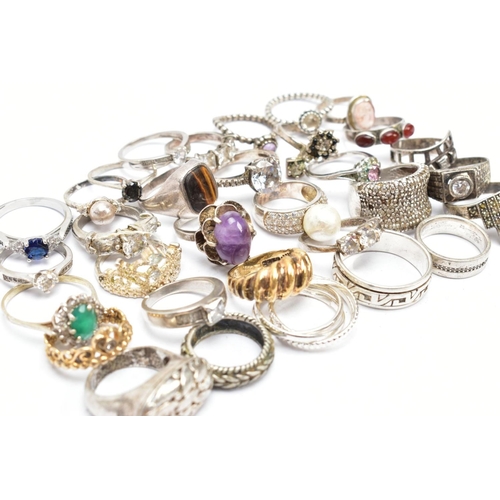 186 - AN ASSORTMENT OF SILVER AND WHITE METAL RINGS, a silver gold plated dome ring, hallmarked Birmingham... 