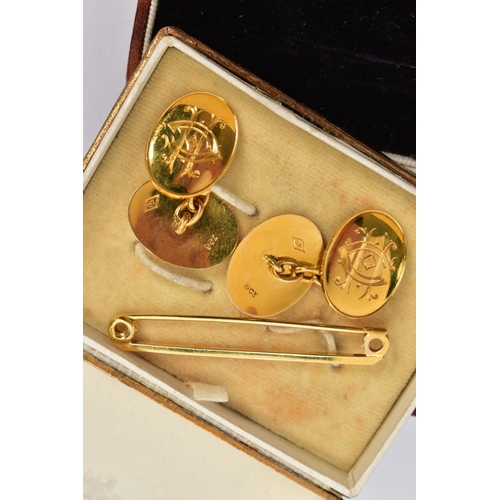 210 - A PAIR OF YELLOW METAL CUFFLINKS AND A BAR BROOCH, the cufflinks each of an oval form with engraved ... 