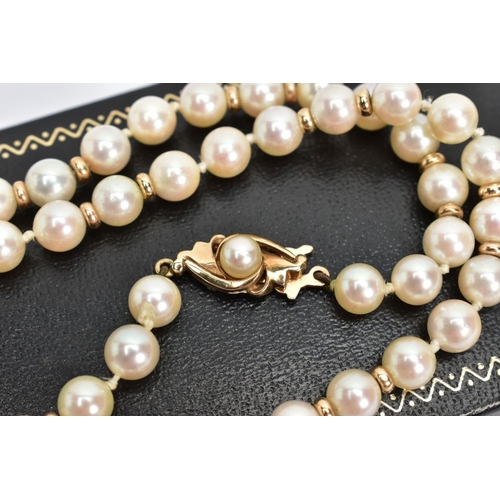 217 - A CULTURED PEARL NECKLACE, a single row strand, each pearl measuring approximately 6mm, interspaced ... 