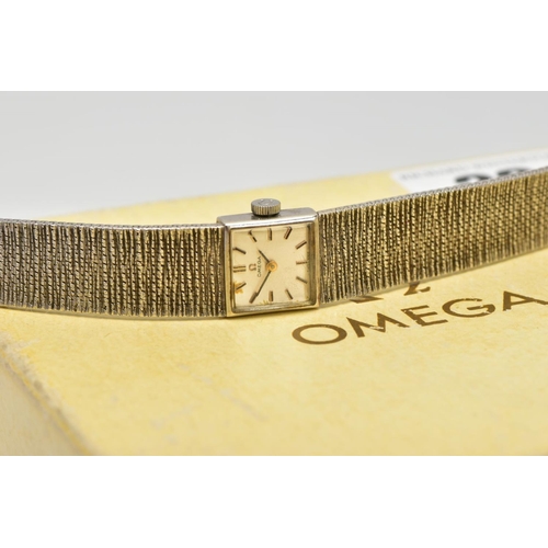 22 - A LADIES 9CT GOLD OMEGA WRISTWATCH, hand wound movement, square dial signed 'Omega', baton markers, ... 