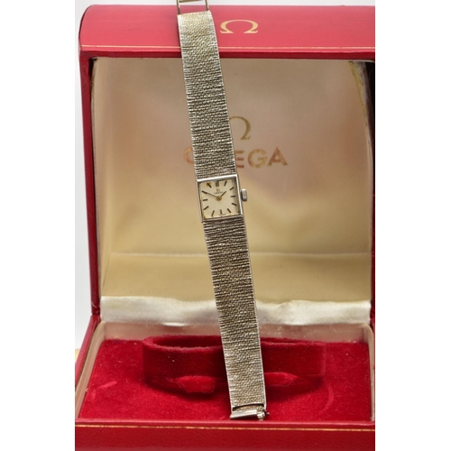 22 - A LADIES 9CT GOLD OMEGA WRISTWATCH, hand wound movement, square dial signed 'Omega', baton markers, ... 