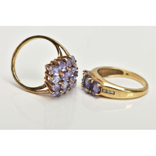 222 - A 9CT GOLD TANZANITE RING AND A SILVER GILT RING, the first designed with three oval cut tanzanite's... 