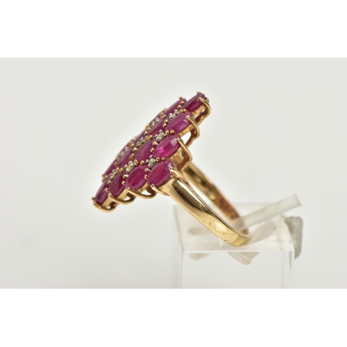 223 - A 9CT GOLD RUBY AND DIAMOND CLUSTER RING, of a lozenge shape, set with a cluster of oval cut rubies ... 