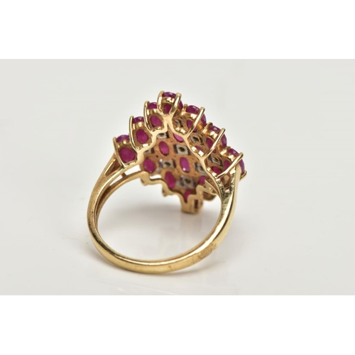 223 - A 9CT GOLD RUBY AND DIAMOND CLUSTER RING, of a lozenge shape, set with a cluster of oval cut rubies ... 