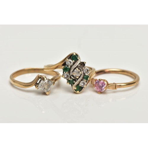 229 - THREE 9CT GOLD DRESS RINGS, the first a lozenge shape set with circular cut emeralds and colourless ... 