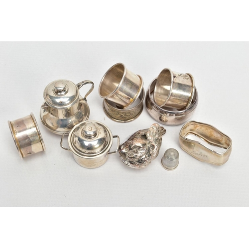 255 - AN ASSORTMENT OF SILVER AND WHITE METAL ITEMS, to include a silver napkin ring engraved with a folia... 