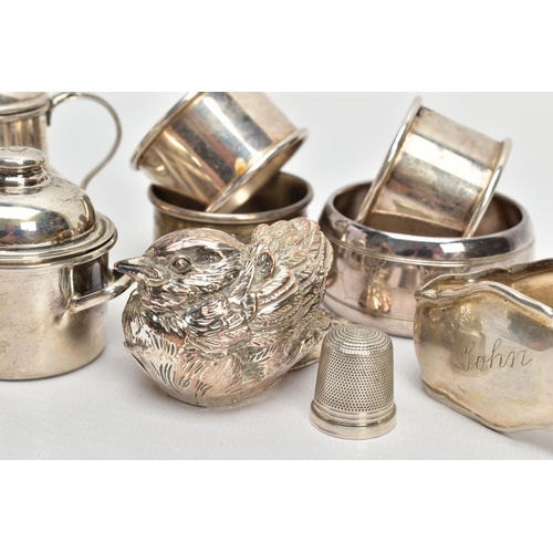 255 - AN ASSORTMENT OF SILVER AND WHITE METAL ITEMS, to include a silver napkin ring engraved with a folia... 