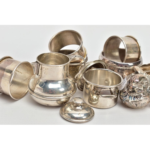 255 - AN ASSORTMENT OF SILVER AND WHITE METAL ITEMS, to include a silver napkin ring engraved with a folia... 