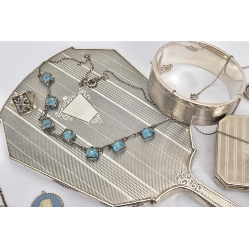 262 - A SELECTION OF SILVER AND WHITE METAL ITEMS, to include a silver vanity mirror decorated with an eng... 