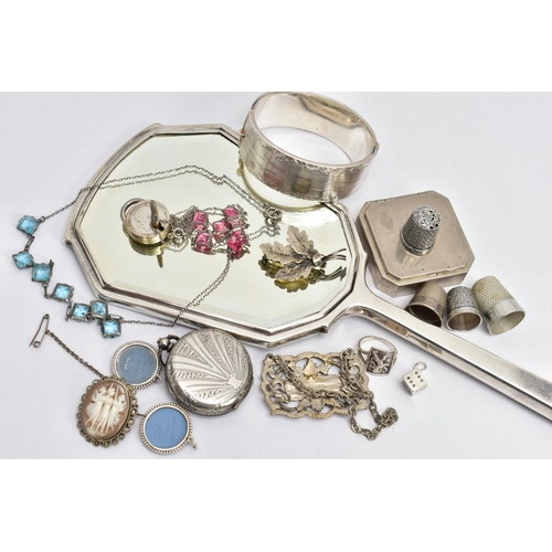 262 - A SELECTION OF SILVER AND WHITE METAL ITEMS, to include a silver vanity mirror decorated with an eng... 