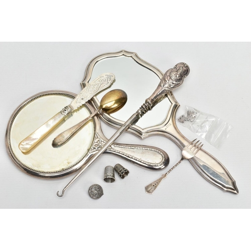 264 - TWO SILVER VANITY MIRRORS, BUTTON HOOK, CUTLERY AND THIMBLES, the first mirror of a circular form, e... 