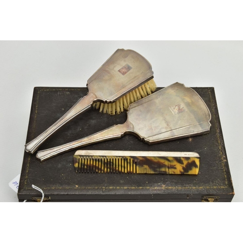 265 - A CASED SILVER VANITY SET, black case which opens to reveal a hair brush, mirror and a comb, each wi... 