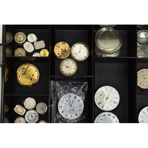 278 - A BOX OF WATCH PARTS, an assortment of  movements, faces and glass, names to include A.W.W.Co Waltha... 