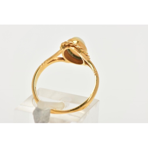 32 - AN 18CT GOLD OPAL RING, designed with an oval cut white opal cabochon, showing flashes of red, orang... 