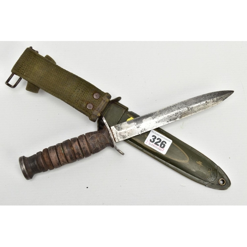 326 - AMERICAN WORLD WAR TWO ERA M3 FIGHTING KNIFE, in metal and canvas scabbard, the knife cross guard is... 