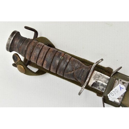 326 - AMERICAN WORLD WAR TWO ERA M3 FIGHTING KNIFE, in metal and canvas scabbard, the knife cross guard is... 