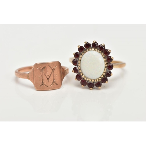 36 - A 9CT GOLD OPAL DRESS RING AND A ROSE METAL SIGNET, an oval opal set with sixteen circular cut garne... 