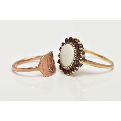 36 - A 9CT GOLD OPAL DRESS RING AND A ROSE METAL SIGNET, an oval opal set with sixteen circular cut garne... 