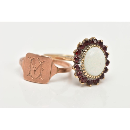 36 - A 9CT GOLD OPAL DRESS RING AND A ROSE METAL SIGNET, an oval opal set with sixteen circular cut garne... 