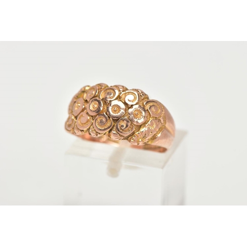 37 - A 9CT GOLD DOME RING, a wide band detailing a floral and scrolling pattern, approximate width 10mm, ... 