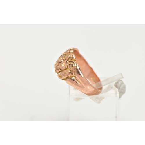 37 - A 9CT GOLD DOME RING, a wide band detailing a floral and scrolling pattern, approximate width 10mm, ... 