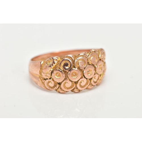 37 - A 9CT GOLD DOME RING, a wide band detailing a floral and scrolling pattern, approximate width 10mm, ... 