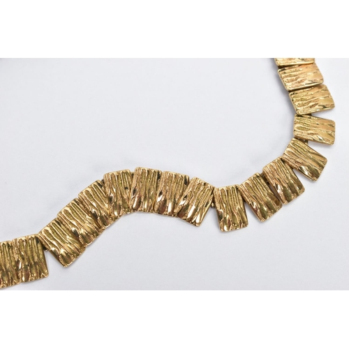 38 - A 9CT GOLD CLEOPATRA NECKLACE, textured gold panels interlinked together, fitted with a spring clasp... 