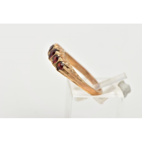 51 - A LATE 20TH CENTURY FIVE STONE GARNET RING, designed with a row of five slightly graduated, circular... 