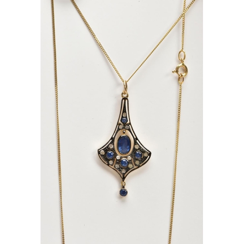 53 - A GEM SET PENDANT NECKLACE, the pendant of a drop fan shape, set centrally with an oval cut sapphire... 