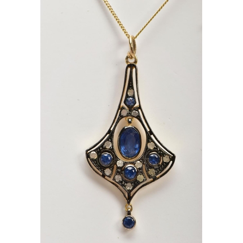 53 - A GEM SET PENDANT NECKLACE, the pendant of a drop fan shape, set centrally with an oval cut sapphire... 