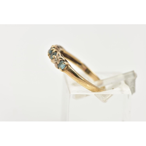 56 - A 9CT GOLD GEM SET HALF HOOP RING, designed with a row of five circular cut aquamarines, cross detai... 