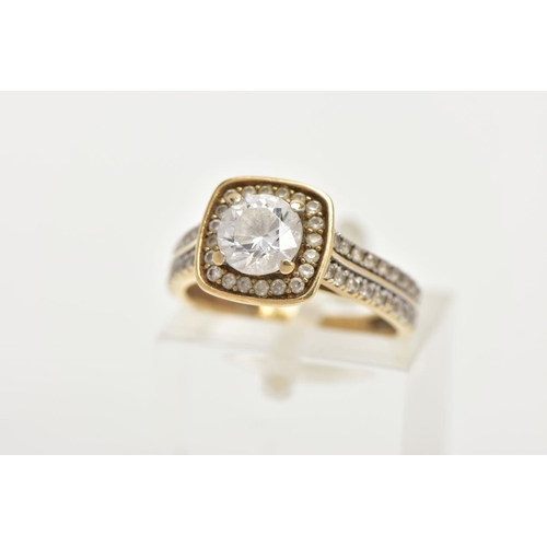 60 - A 9CT GOLD CUBIC ZIRCONIA DRESS RING, centring on a colourless circular cut cubic zirconia, within a... 