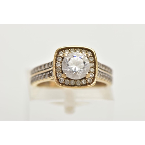 60 - A 9CT GOLD CUBIC ZIRCONIA DRESS RING, centring on a colourless circular cut cubic zirconia, within a... 