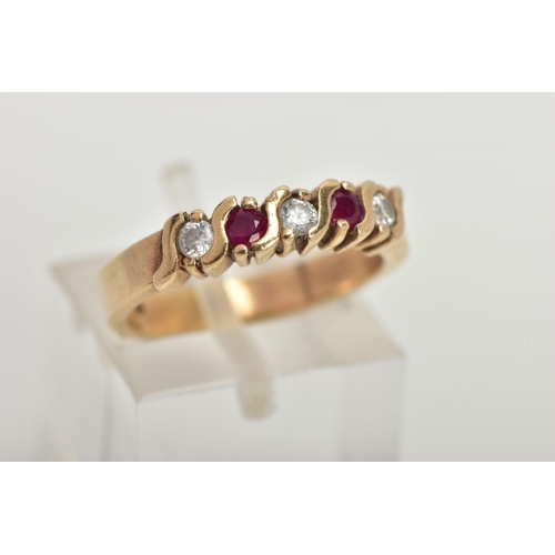 65 - A 9CT GOLD HALF HOOP RING, designed with a row of three circular cut cubic zirconia interspaced with... 