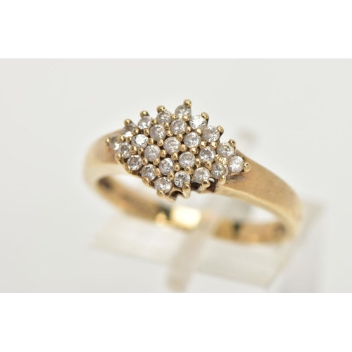 67 - A 9CT GOLD CUBIC ZIRCONIA RING, of a lozenge shape set with a cluster of colourless cubic zirconia s... 