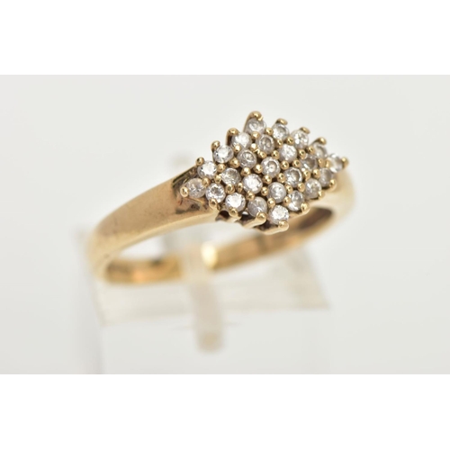 67 - A 9CT GOLD CUBIC ZIRCONIA RING, of a lozenge shape set with a cluster of colourless cubic zirconia s... 