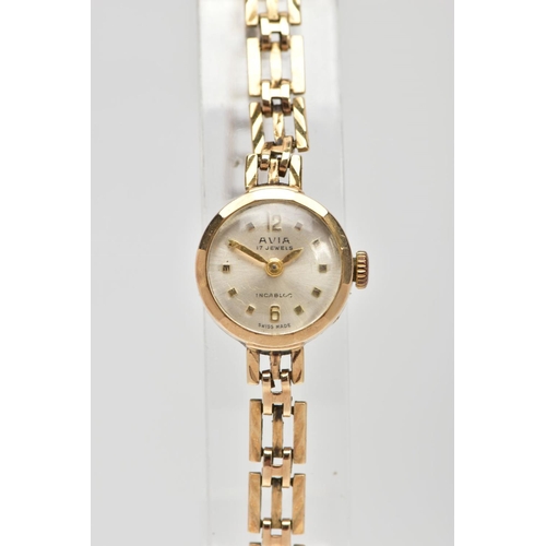 73 - A LADIES 9CT GOLD 'AVIA' WRISTWATCH, movement requires some attention, round silver dial signed 'Avi... 