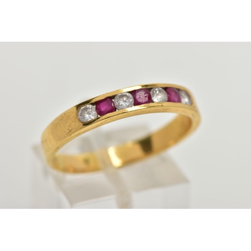 98 - A RUBY AND DIAMOND HALF HOOP RING, yellow metal band, designed with a row of three channel set circu... 