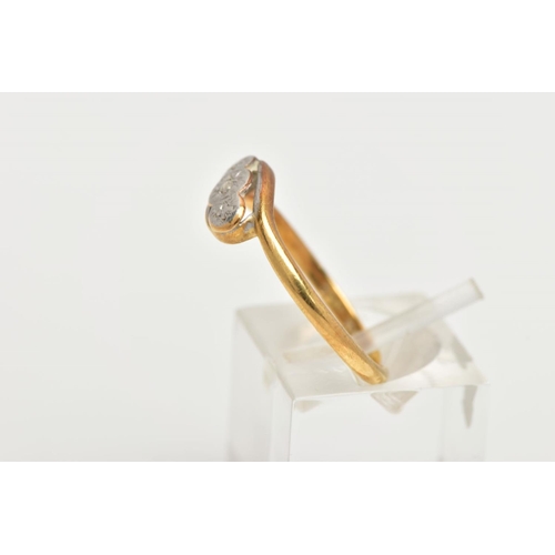 99 - AN AF YELLOW METAL DIAMOND RING, of a cross over design with a central illusion set single cut diamo... 