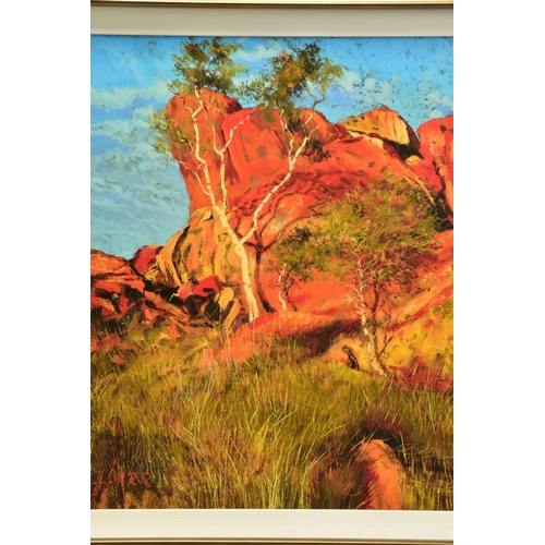 434 - ROLF HARRIS (AUSTRALIAN 1930) 'SUN ON DEVIL'S MARBLES', a limited edition print of an Australian lan... 