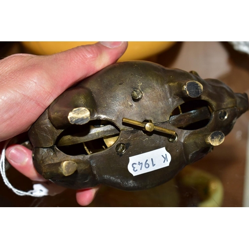 447 - A 19TH CENTURY STYLE NOVELTY BRONZE TABLE BELL IN THE FRORM OF A PIG, fitted with a clockwork moveme... 